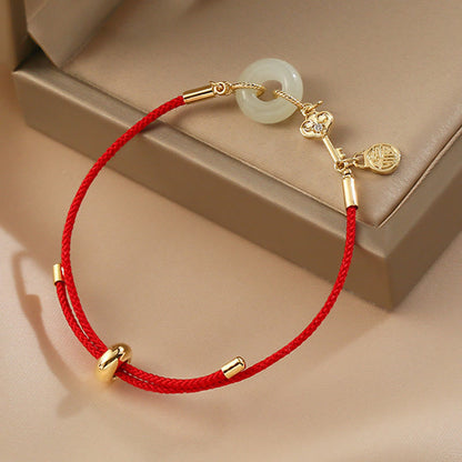 Hetian Jade-Armband mit roter Kordel