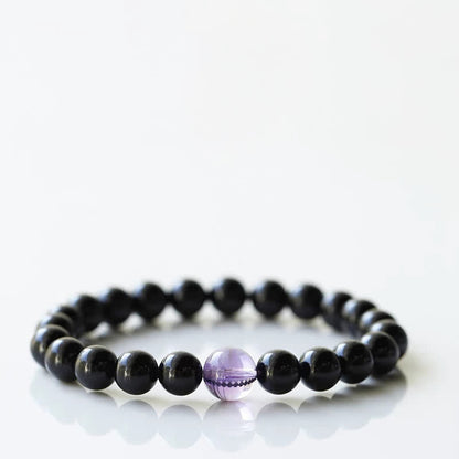 Armband mit schwarzem Turmalin und Sternzeichen-Tiermotiv
