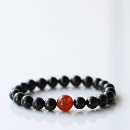 Armband mit schwarzem Turmalin und Sternzeichen-Tiermotiv