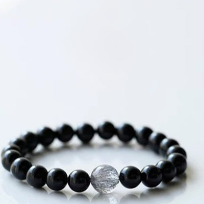 Armband mit schwarzem Turmalin und Sternzeichen-Tiermotiv