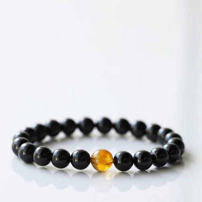 Armband mit schwarzem Turmalin und Sternzeichen-Tiermotiv