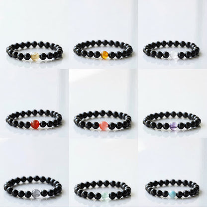 Armband mit schwarzem Turmalin und Sternzeichen-Tiermotiv