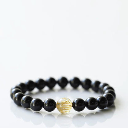 Armband mit schwarzem Turmalin und Sternzeichen-Tiermotiv