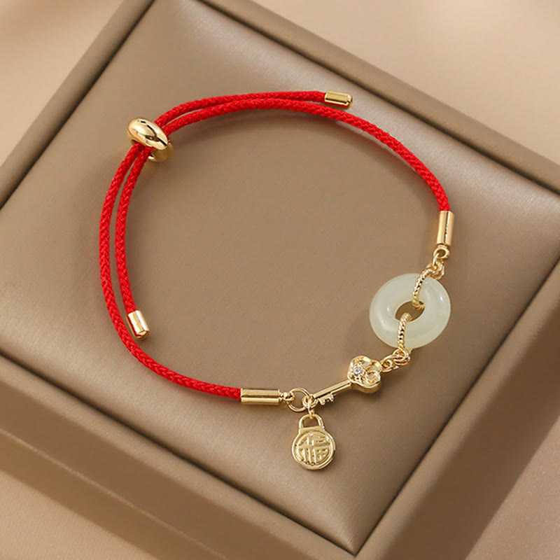 Hetian Jade-Armband mit roter Kordel