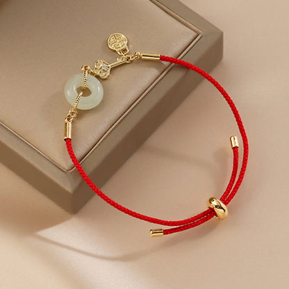Hetian Jade-Armband mit roter Kordel